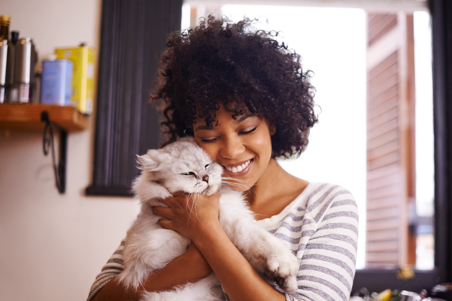 After preventing heartworm in her cat woman snuggles her close in Columbia
